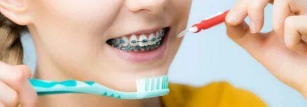 girl flossing