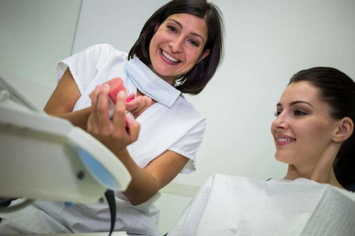 A person visiting an orthodontist for Invisalign treatment